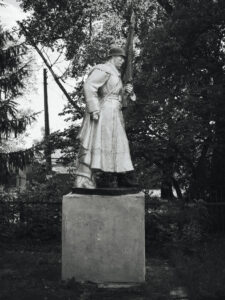 A stone monument of a soldier.